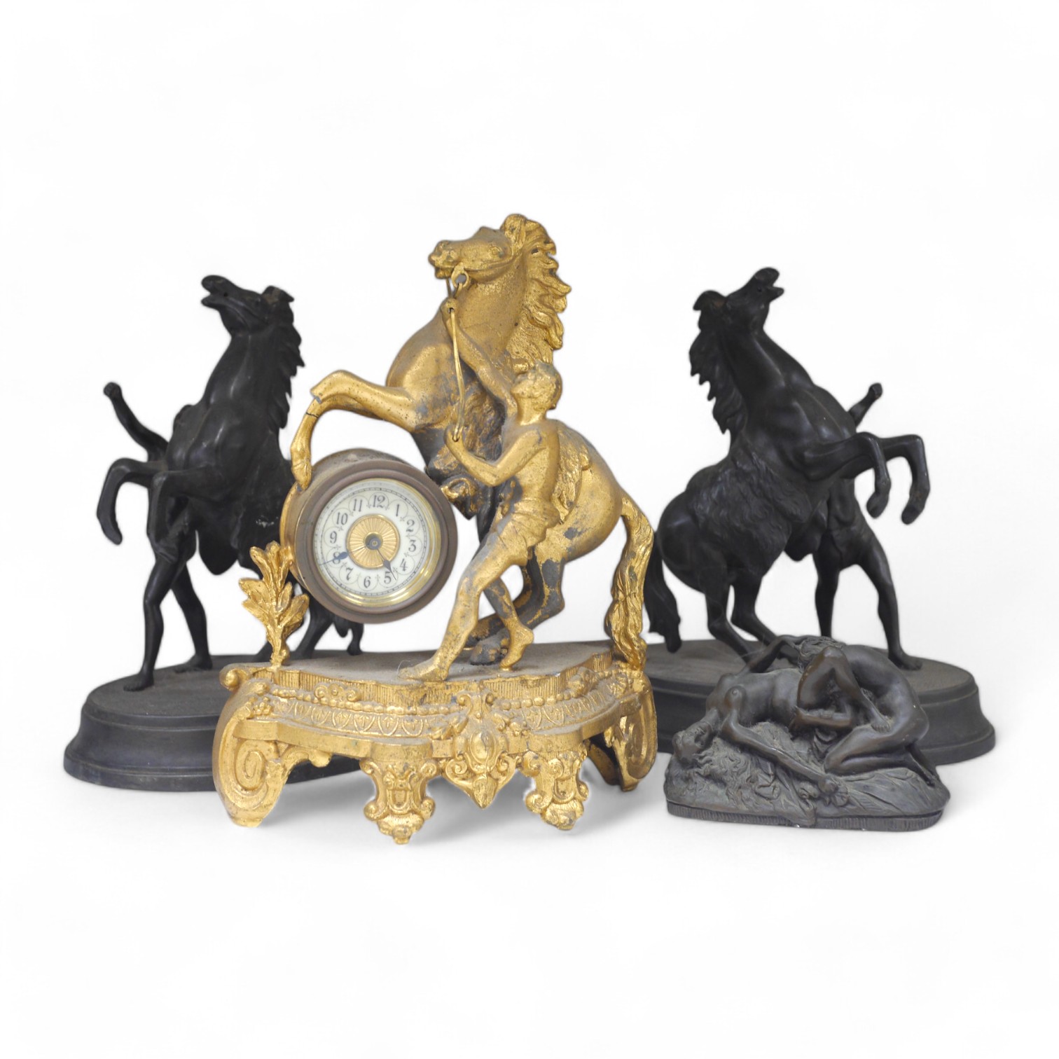 Two Spelter Marley horse groups, a similar timepiece and a bronzed resin erotic figure group after Jef Lambeaux (1852-1908), largest 24cm. Condition - fair